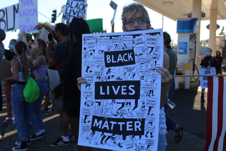 Opposing rallies -- one for Black Lives Matter, another for the pro-police "Blue Lives Matter" -- take place along Northeast Third Avenue in downtown Camas on Friday, Aug. 28. (Photos by Kelly Moyer/Post-Record)