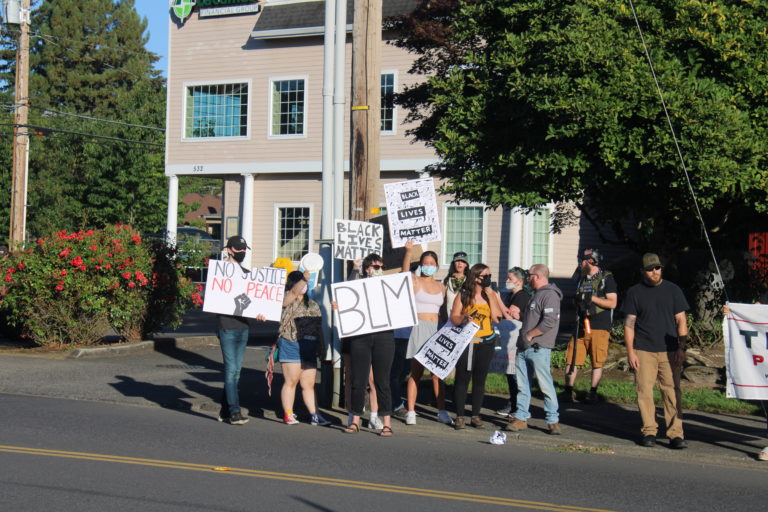 Opposing rallies -- one for Black Lives Matter, another for the pro-police "Blue Lives Matter" -- take place along Northeast Third Avenue in downtown Camas on Friday, Aug. 28. (Photos by Kelly Moyer/Post-Record)