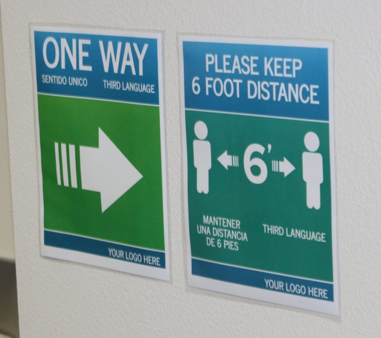 Signs remind students and teachers to walk one way and maintain social distancing at Gause Elementary School in Washougal.