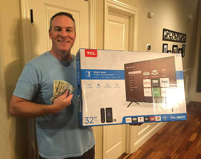 Vancouver resident Gordon Thomas shows off the prizes he won during one of the &quot;The Chubby Leprechaun&quot; treasure hunts.