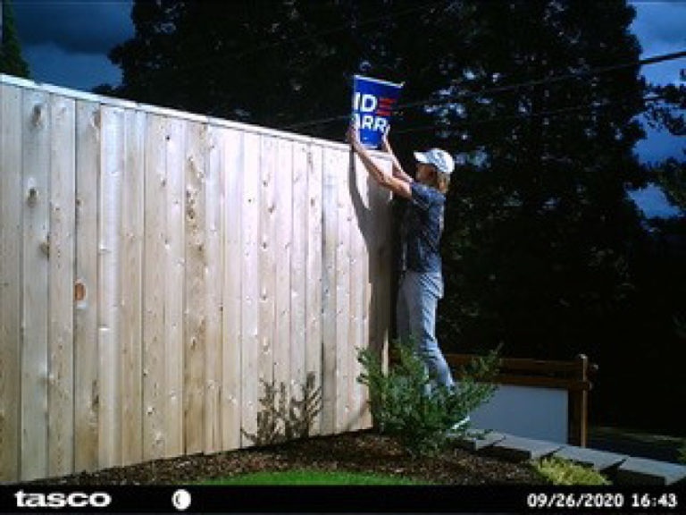 A Washougal couple's outside camera captured this image of a person trying to tear down the couple's Biden-Harris campaign sign on Sept. 26. Washougal police have been unable to identify the suspect in the photos.