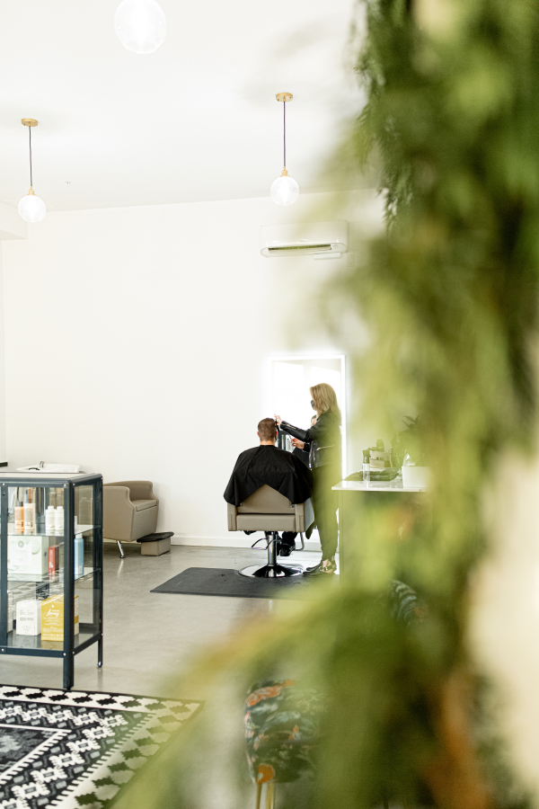 Contributed photo courtesy Olivia Peabody 
 Lauren Plumberg styles the hair of a customer at Eden Collective in downtown Washougal in November.