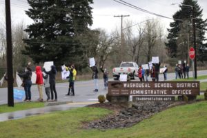 A group protests school closures due to the COVID-19 pandemic in front of the Washougal School District headquarters on Dec. 17, 2020. (Doug Flanagan/Post-Record)
