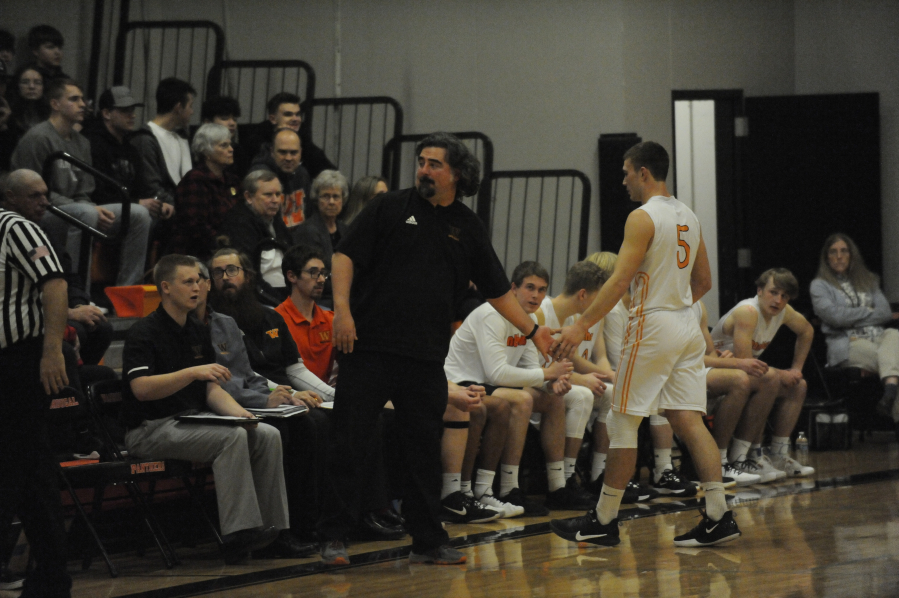 AJ LaBree (center) enters his third season as the Washouga High School boys basketball head coach AJ LaBree coaches a game in early 2020.