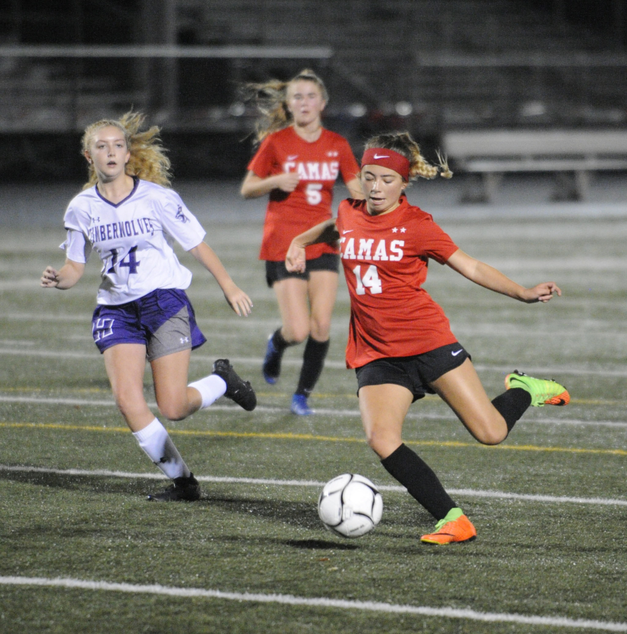 Camas High School soccer player forward Kiya Gramps scores a goal during a game at Doc Harris Stadium in October 2019. (Post-Record file photos)