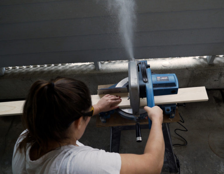 Contributed photo courtesy Jackie Gollbach 
 Washougal resident Jackie Gollbach builds a wooden sign during the filming of the first video for her new YouTube channel, &quot;Nail Polish and Power Tools.&quot;
