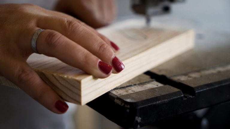 Contributed photo courtesy Jackie Gollbach 
 Washougal resident Jackie Gollbach builds a wooden sign during the filming of the first video for her new YouTube channel, &quot;Nail Polish and Power Tools.&quot;