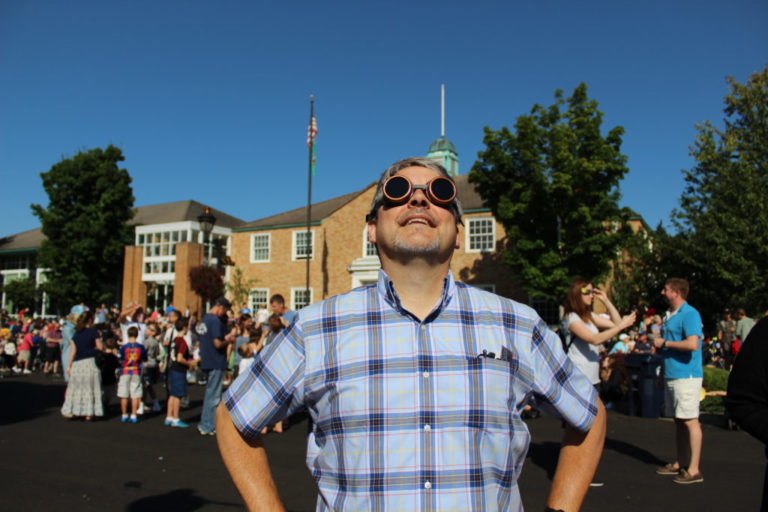 Camas Deputy Fire Marshal Randy Miller made his own eclipse-viewing glasses out of welding glass. Here, Miller watches as the moon begins to almost-fully cover the sun on Monday, Aug. 21, 2017.