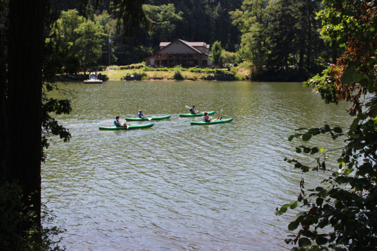 Kayakers on Camas' Lacamas Lake pass by Lacamas Lake Lodge on Sunday, July 26, 2020.