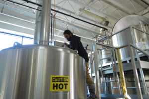 Head Logsdon Farmhouse Ales brewer Shilpi Halemane stirs oatmeal stout in the downtown Washougal brewery in 2018. (Post-Record file photo)
