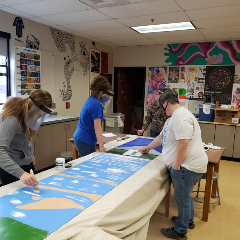 Jemtegaard Middle School teacher Dani Allen (right) instructs students in April 2021.