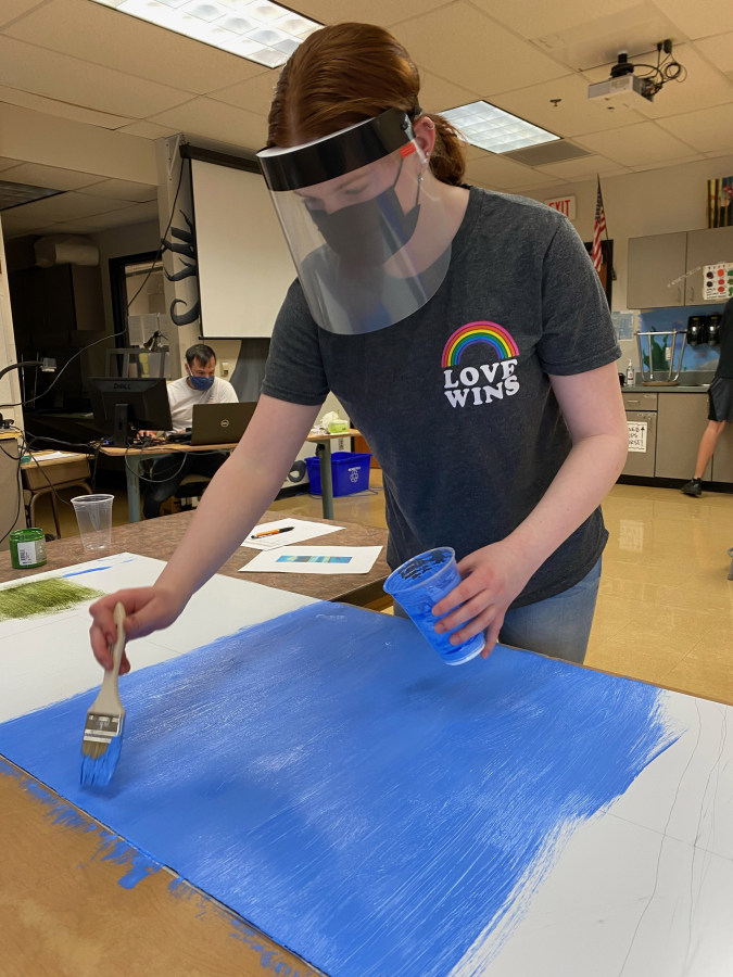 Contributed photo courtesy Dani Allen 
 Washougal High School senior Taylor Vincent works on a painting as part of the Unite! Washougal community coalition&#039;s latest beautification project. (Doug Flanagan/Post-Record)