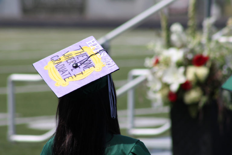 Right: A Hayes Freedom High School senior wears a cap decorated with the words  "The One Where I Graduate" at their school's graduation ceremony on Saturday, June 12, 2021.
