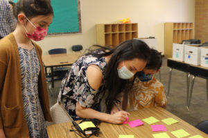 Fernanda Titcomb (center) attends a back-to-school event for the Camas Connect Academy with her children, Anela (left) and Santiago (right), on Tuesday, Aug. 24, 2021. Titcomb said safety concerns  related to the COVID-19 pandemic prompted her family to enroll in the district's remote school. (Kelly Moyer/Post-Record)