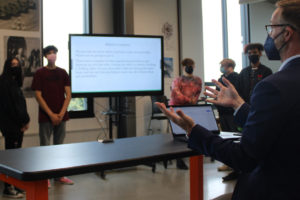 Discovery High School Principal Aaron Smith (right) speaks to a group of teens during a student club presentation at the Camas high school on Friday, Sept. 10, 2021. (Kelly Moyer/Post-Record)