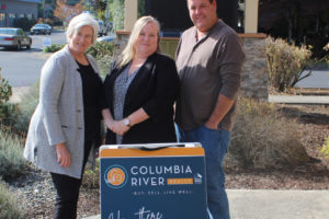 Columbia River Realty owner Charline Wright (left), broker Angie Tauialo (center) and broker Tim Plagman (right) stand outside of the real estate agency's new office on "E" Street in Washougal on Oct. 4, 2021. (Doug Flanagan/Post-Record)