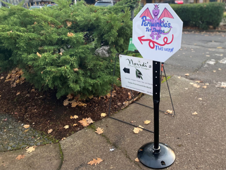 A sign near the corner of Northeast Fourth Avenue and Northeast Cedar Street in downtown Camas points the way to the newly opened Periwinkle's Toy Shoppe, at 326 N.E. Cedar St., on Sunday, Nov.