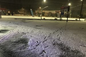 Footprints in freshly fallen snow lead away from the 7 Market in Camas on Dec. 28, 2021. Police followed the footprints through the neighborhood and discovered two burglary suspects carrying backpacks filled with stolen goods. (Contributed photo courtesy of the Camas and Washougal police departments)