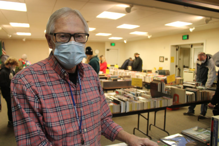 Francher Donaldson, a member of the Friends &amp; Foundation of the Camas Library's board of directors, oversees the Foundation's annual book sale inside the Camas Public Library on Friday, Dec.