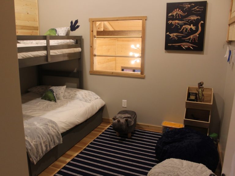 The children's bedroom at the "Jurassic Retreat" rental house in rural Washougal includes a variety of dinosaur-themed toys and games.