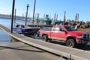 Washougal resident Mike Amodeo lowers his boat into the Columbia River at Parker's Landing Marina on Jan. 25, 2022. (Doug Flanagan/Post-Record)