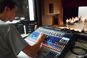 Washougal High school senior Marcus Bennett controls a soundboard during a  rehearsal for the school's production of "Annie Get Your Gun" in 2018. (Post-Record file photo)