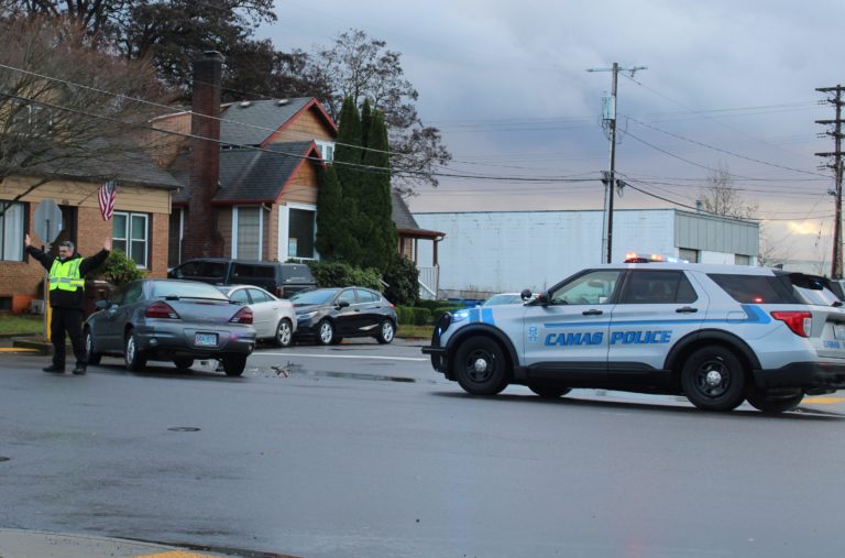 Camas police direct traffic after a car crash in downtown Camas on Nov. 23, 2021.
