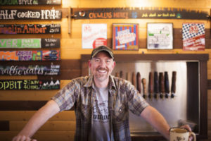 54-40 Brewing Company owner and lead brewer Bolt Minister has struck a deal with a Ridgefield-based distribution company to distrubute a selection of the brewery's beers across Washington state in 12-ounce six-packs and draft form. (Contributed photo courtesy of Corwin Beverage Company)