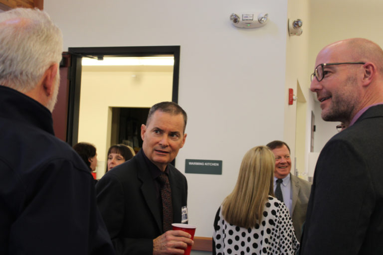 Keith Stahley (second from left), the city of Olympia, Wash.’s assistant city manager and one of four finalists vying to be the city of Camas’ next city administrator, speaks to community members and city of Camas staff, including the city’s interim city administrator, Jeff Swanson (right), during a meet-and-greet event at Lacamas Lake Lodge on Thursday, May 12, 2022.