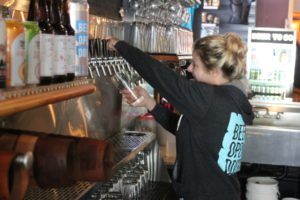 Trap Door Brewing beertender Heather Stoller pours a Trap Door IPA on Monday, May 16,  2022, at the Vancouver brewery. (Doug Flanagan/Post-Record)