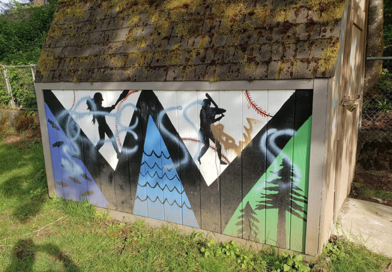 Graffiti mars a mural on the East County Little League&#039;s equipment shed at Lower Hathaway Park in Washougal in May 2022.