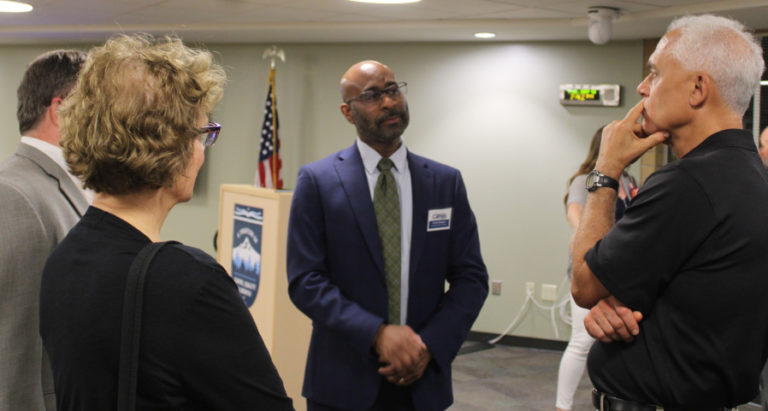 Camas city administrator candidate Bristol Ellington (center) talks with Camas Mayor Steve Hogan (far left), Hogan's wife, Mary Beth Hogan (second from left) and Camas City Councilman Tim Hein (right) during an open house at the Camas School District's Zellerbach Administration Center, on Tuesday, Sept. 13, 2022.