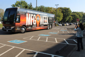 The Association of Washington Business' Manufacturing Week tour bus pulls into the Analog Devices parking lot in Camas on Monday morning, Oct. 10, 2022. (Kelly Moyer/Post-Record)