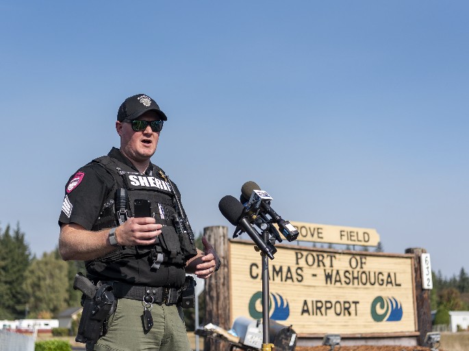 Clark County Sheriff public information officer Chris Skidmore talks to media Monday, Sept. 17, 2022, during a briefing at Grove Field in Camas. The Nakia Creek Fire ballooned to more than 1,400 acres after dry and windy conditions on Sunday.