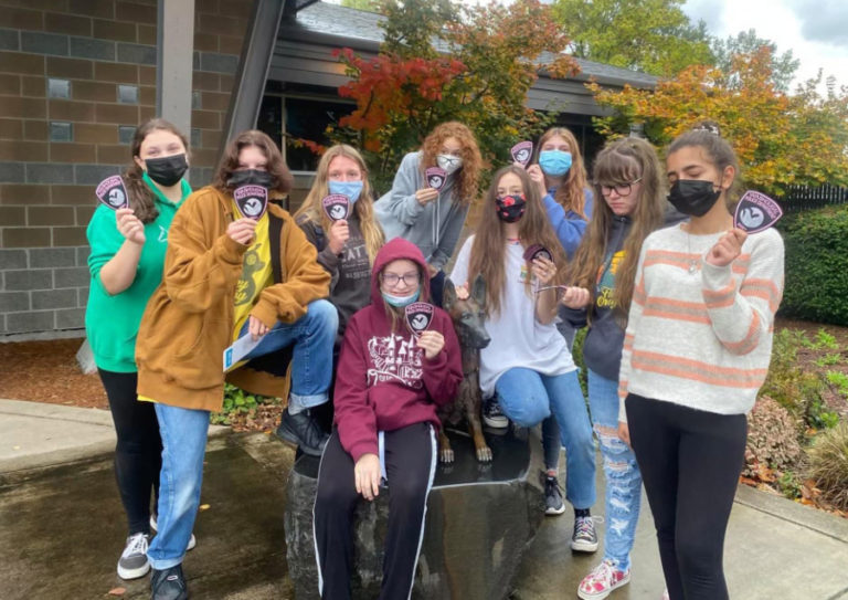Contributed photo courtesy Tammy Mackey 
 Members of the Washougal-based Girl Scout Troop 45703 hold pink Washougal Police Department patches, which were distrubuted as part of The Pink Patch Project, which raises to raise money and awareness for breast cancer charities.