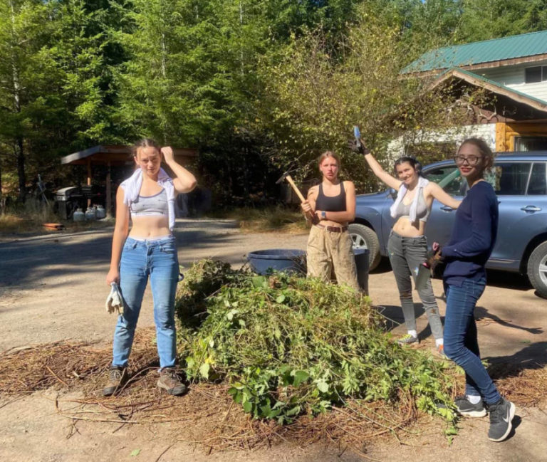 Contributed photo courtesy Tammy Mackey 
 Members of Girl Scout Troop 45703 served a local elderly couple by removing and chipping three trailers' worth of yard debris on Saturday, July 16. "This saved the couple money in disposal and helped them clean up a yard that had gotten away from them with the spring rains," troop leader Tammy Mackey said.