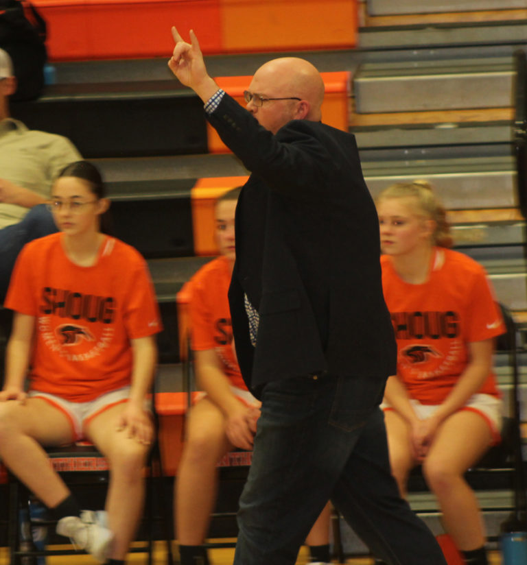New Washougal High School girls basketball coach Tim Melcher (center) calls a play during the first half of the Panthers' game against visiting Tumwater on Friday, Dec.