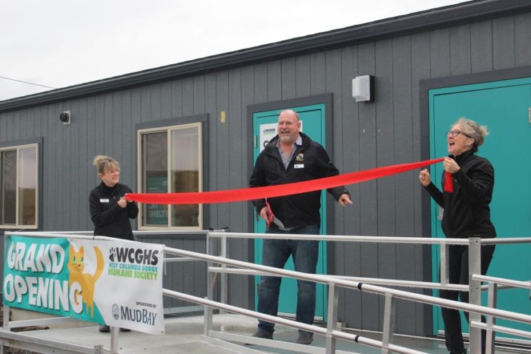 Doug Flanagan/Post-Record 
 Washougal Mayor David Stuebe (center) talks with West Columbia Gorge Humane Society executive director Micki Simeone (right) as Peggy DiPrima (left), the humane society's director of advancement, development, fundraising and events, looks on during a ribbon-cutting ceremony on Saturday, Jan. 21.