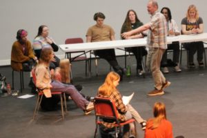 Washougal High School drama teacher Kelly Gregersen (center, standing) talks to students on Thursday, Feb. 2, 2023, during a rehearsal for Washougal High School's upcoming "Oh, What a Knight" Renaissance dinner theater production set for 6 p.m. Friday and Saturday, Feb. 17-18. (Photos by Doug Flanagan/Post-Record)