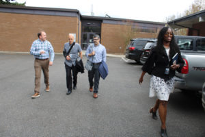 Camas School District Assistant Superintendent Charlene Williams (right) walks with Camas School Board members Corey McEnry (left) and Doug Quinn (second from left) and the school district's new superintendent, John Anzalone (second from right), outside Hayes Freedom High School on Monday, March 28, 2022. (Kelly Moyer/Post-Record files) 