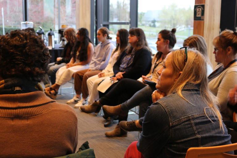 Members of The School Superintendents Association's Innovative Districts Empowering All Learners cohort participants listen to Washougal High School students discuss the ways that student voice influences school culture, policy and programs on Tuesday, March 28.