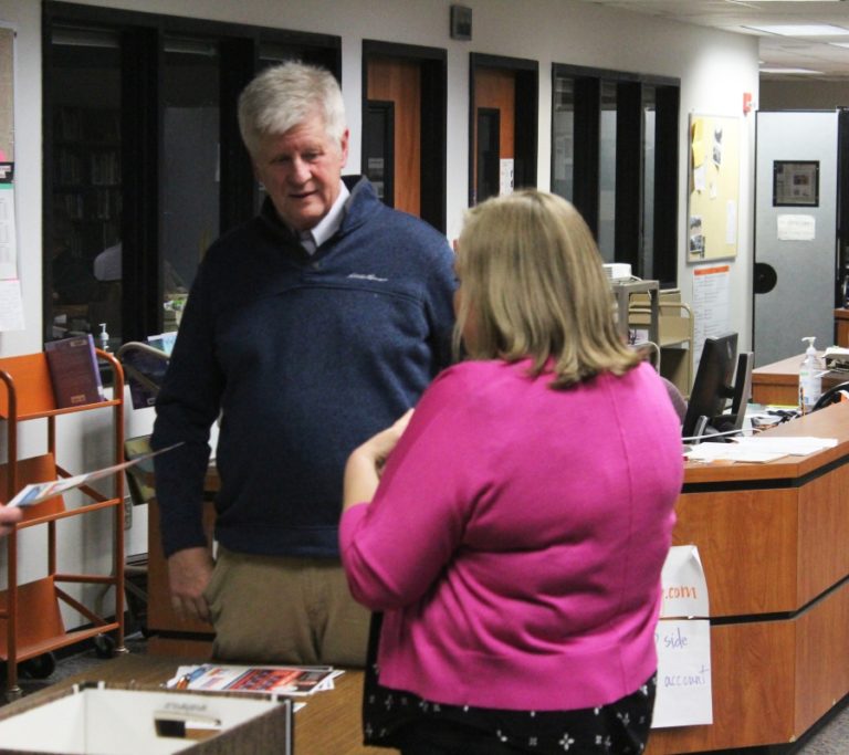 Washougal School Board member Jim Cooper (left) talks to Hathaway Elementary School Principal Wendy Morrill (right) during the school district&#039;s March 28, 2023, at Washougal High School.