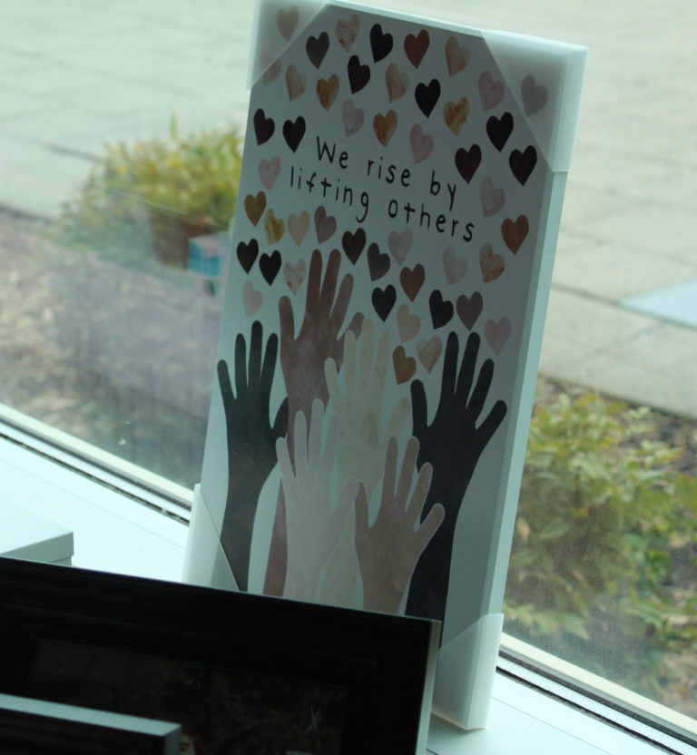 Artwork that inspired a mural painting sits on the desk of Brenda Schallberger, coordinator of the Camas School District’s Family-Community Resource Center, on Friday, April 21, 2023.