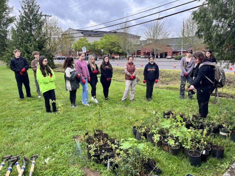 Contributed photo courtesy Janet Grove 
 Micayla Jones, the Watershed Alliance of Southwest Washington's volunteer coordinator (far right), talks to Washougal High School Advanced Placement environmental science students about planting native plants alongside Campen Creek in Washougal on Friday, May 5.