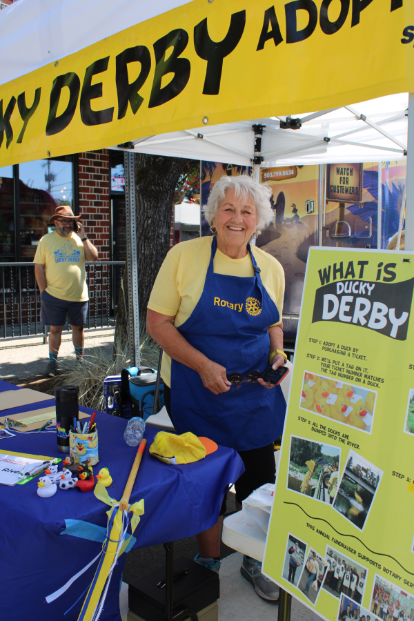 Washougal City Council member and former Washougal Mayor Molly Coston works at the Rotary Club of Camas-Washougal's Ducky Derby booth on Northeast Dallas Street in downtown Camas, Friday, July 21, 2023, during the 2023 Camas Days celebration. (Kelly Moyer/Post-Record files)