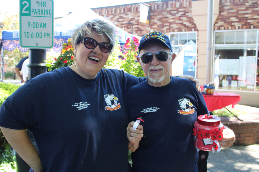 Members of the Veterans of Foreign Wars Post 4278 hand out poppies during the 2023 Camas Days festival in downtown Camas, Friday, July 21, 2023. (Kelly Moyer/Post-Record)