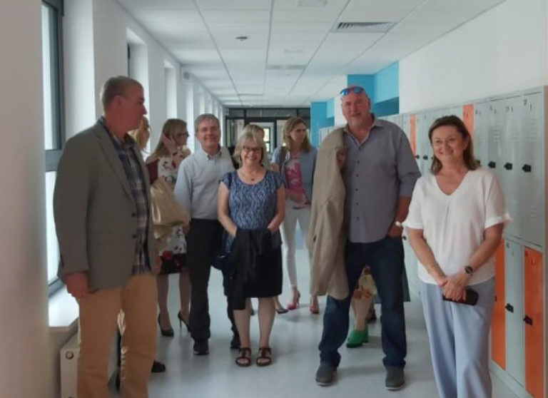 Contributed photo courtesy Zielonki, Poland 
 Washougal city councilmember David Fritz (far left), city manager David Scott (third from left) and mayor David Stuebe (second from right) 
 take a tour of Zielonki, Poland's newest elementary school in June.