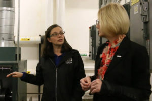 Washougal School District maintenance supervisor Jessica Beehner (left) talks with superintendent Mary Templeton in Washougal High School's boiler room in 2023. (Post-Record file photo)