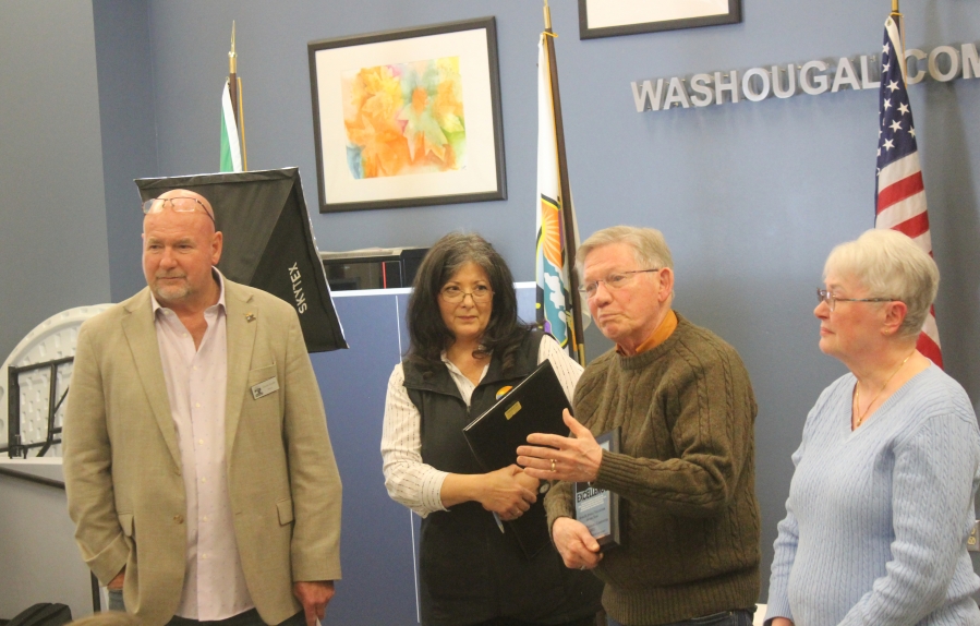 Doug Flanagan/Post-Record
Chuck Carpenter (second from right) speaks after being named as the co-winner of the 2023 Rose M. Jewell Volunteer of the Year award, along with his wife Barbara (far right), as Mayor David Stuebe (far left) and community engegement manager Rose Jewell (second from left) listen during the city of Washougal’s Hometown Heroes event, held March 21 at the Washougal Community Center.