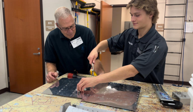 A volunteer works with a student at Cascadia Technical Academy in 2023.